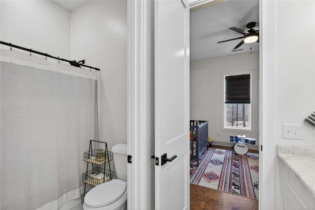 433 Old Roanoke Road Bowdon, GA 30108 - Photo 21 of 52 a bathroom with a sink toilet and shower