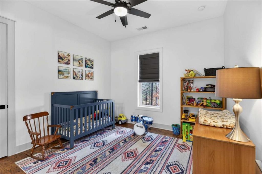 433 Old Roanoke Road Bowdon, GA 30108 - Photo 22 of 52 a bedroom with furniture and a window