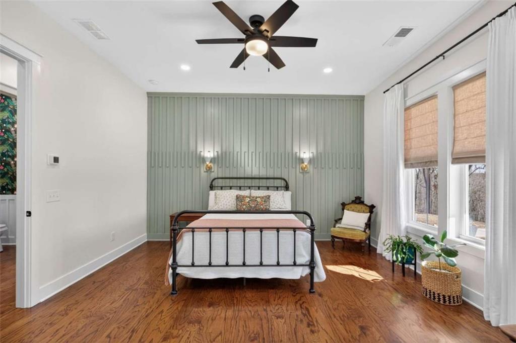 433 Old Roanoke Road Bowdon, GA 30108 - Photo 23 of 52 a bedroom with a bed and a potted plant