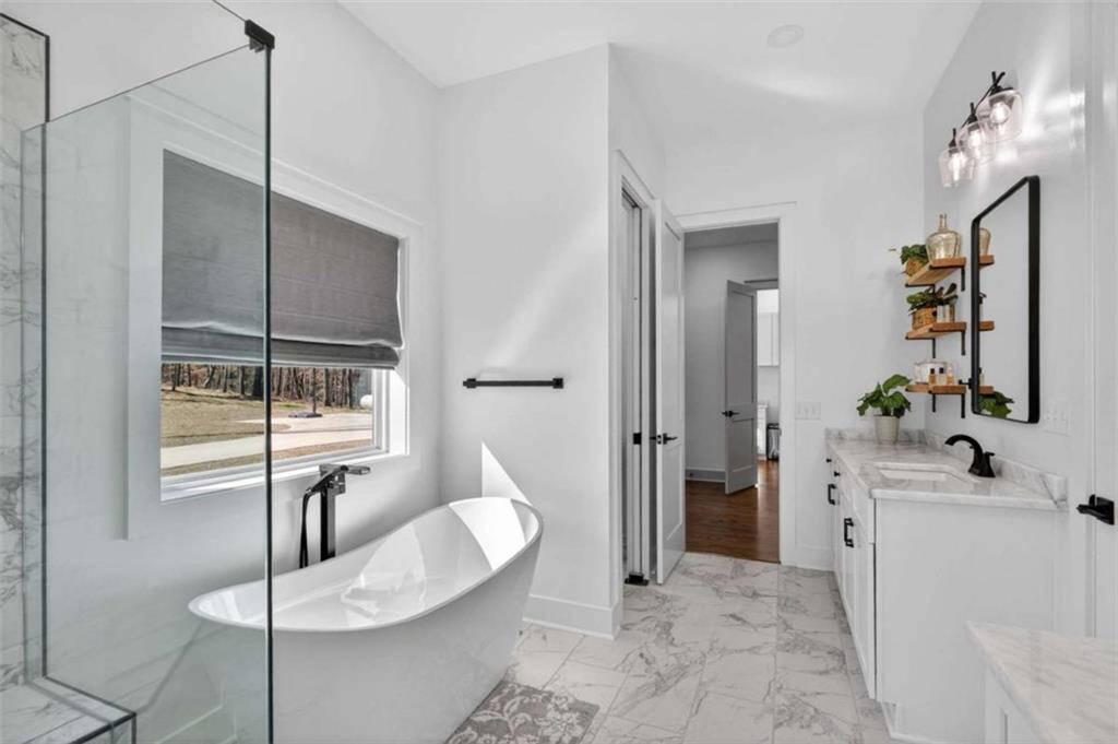 433 Old Roanoke Road Bowdon, GA 30108 - Photo 29 of 52 a bathroom with a sink and a mirror