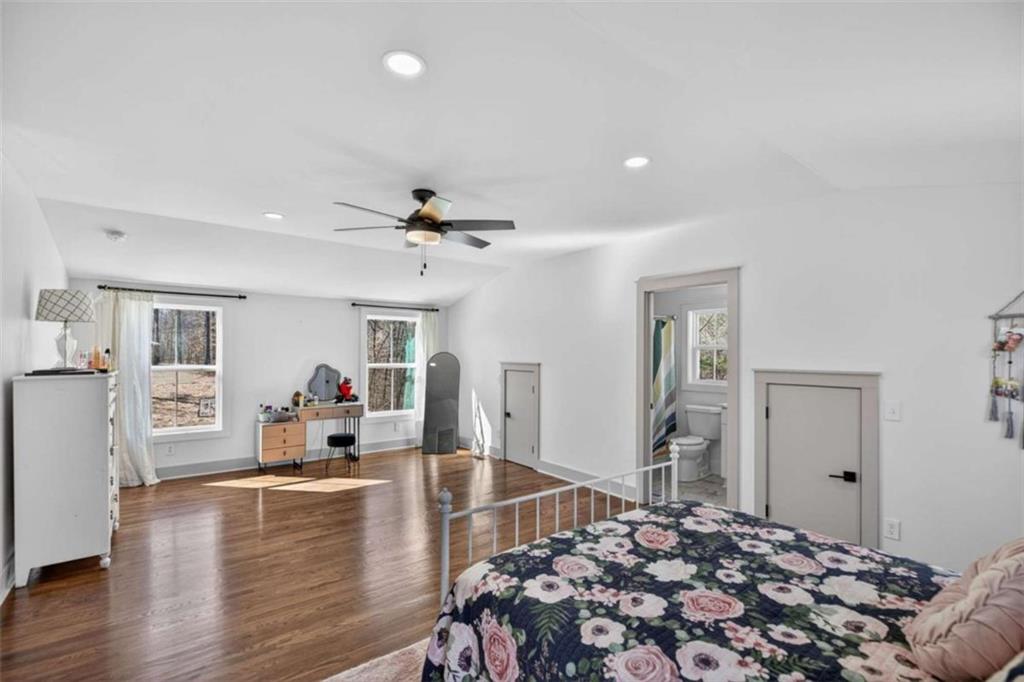 433 Old Roanoke Road Bowdon, GA 30108 - Photo 35 of 52 a living room with furniture and a wooden floor