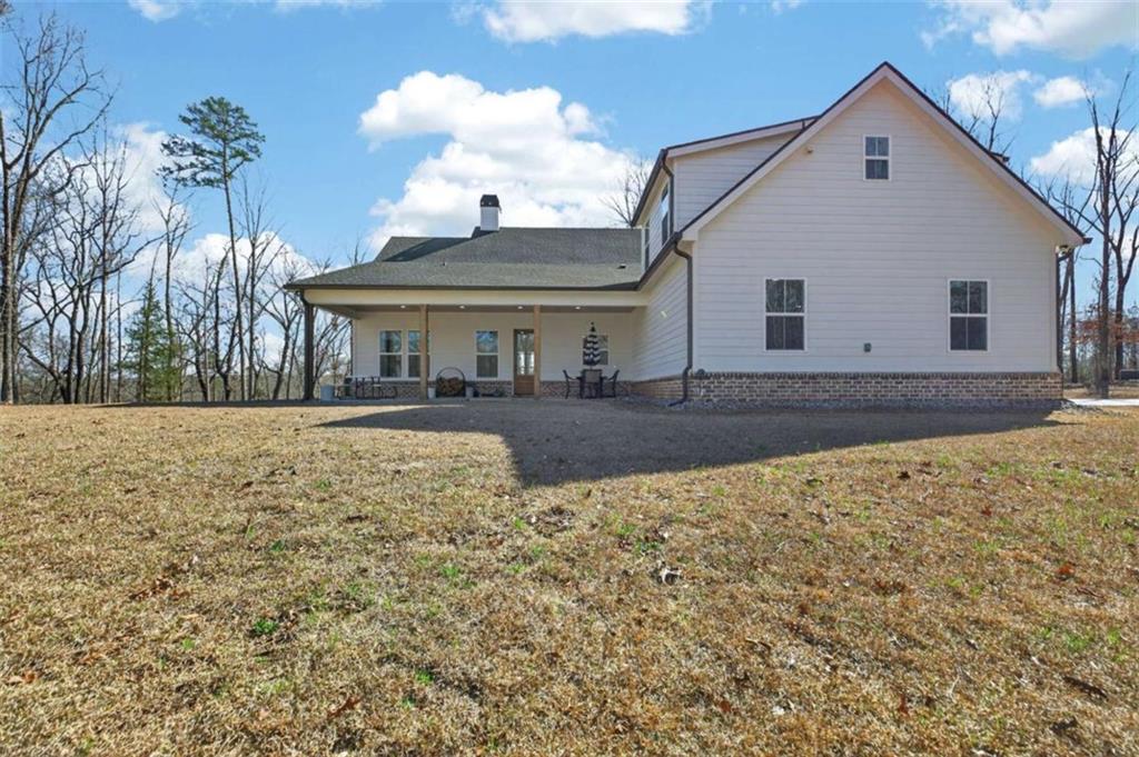 433 Old Roanoke Road Bowdon, GA 30108 - Photo 40 of 52 a view of a house with a yard