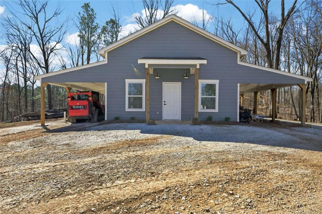 433 Old Roanoke Road Bowdon, GA 30108 - Photo 43 of 52 a view of a house with a yard