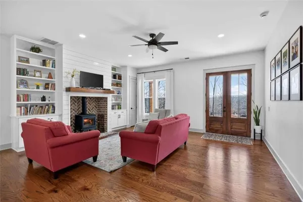 a living room with furniture or flat screen tv and a fireplace