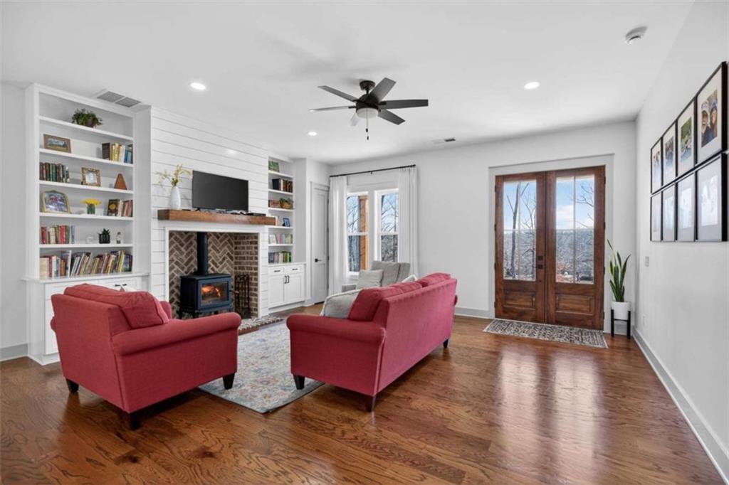 433 Old Roanoke Road Bowdon, GA 30108 - Photo 6 of 52 a living room with furniture a flat screen tv and a fireplace