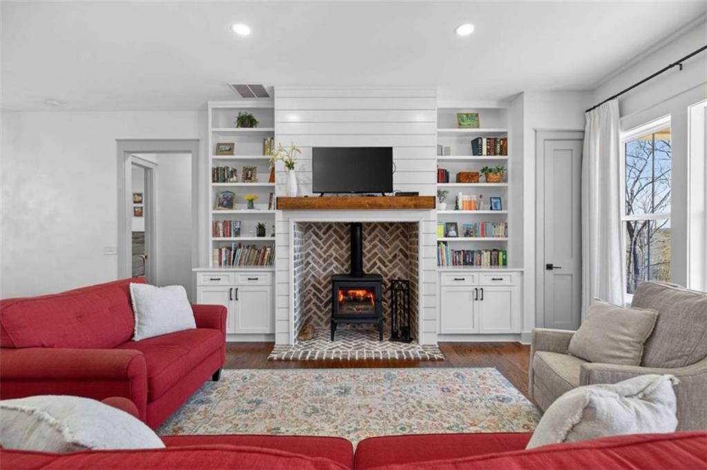 433 Old Roanoke Road Bowdon, GA 30108 - Photo 7 of 52 a living room with furniture or flat screen tv and a fireplace