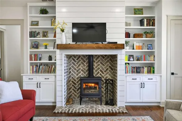 a living room with furniture fireplace and flat screen