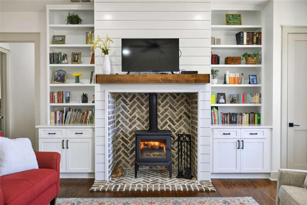 433 Old Roanoke Road Bowdon, GA 30108 - Photo 8 of 52 a living room with furniture and a fireplace