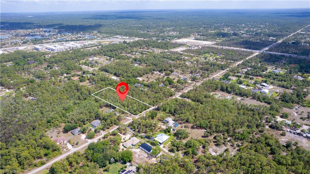 0 Wilson Boulevard North Naples, FL 34120 - Photo 3 of 8 an aerial view of residential house and lake