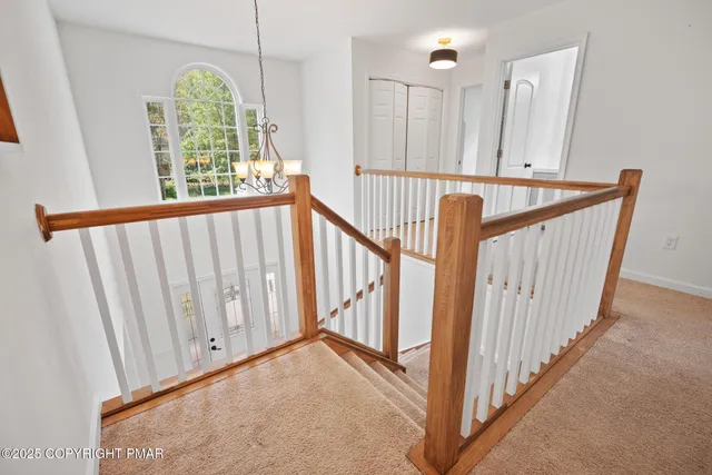 a view of a hallway with windows