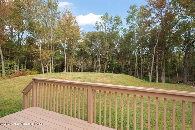 a view of a balcony with trees