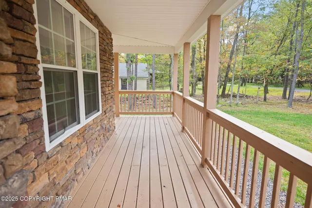 a view of balcony with wooden floor