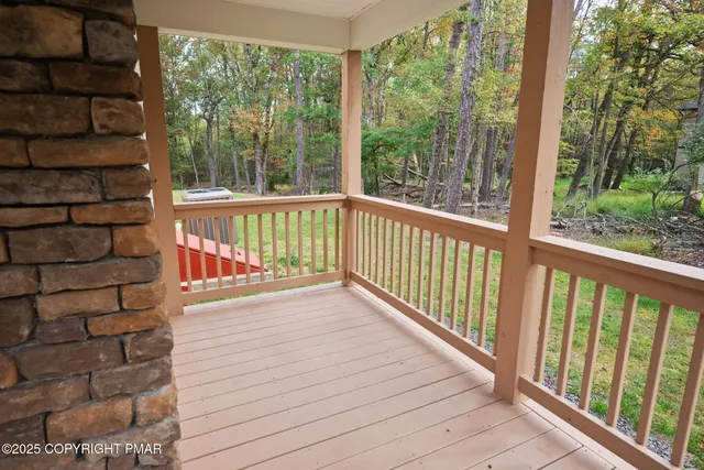 a view of a balcony with wooden floor