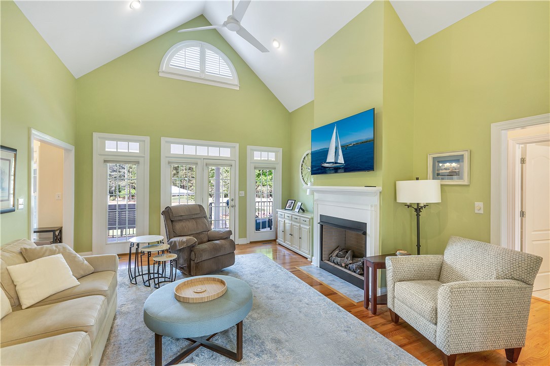 3108 Cobbs Way Anderson, SC 29621 - Photo 12 of 44 This airy living area features high ceilings and a cozy fireplace, perfect for relaxation and gatherings.