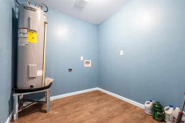 a bathroom with a toilet and a shower curtain