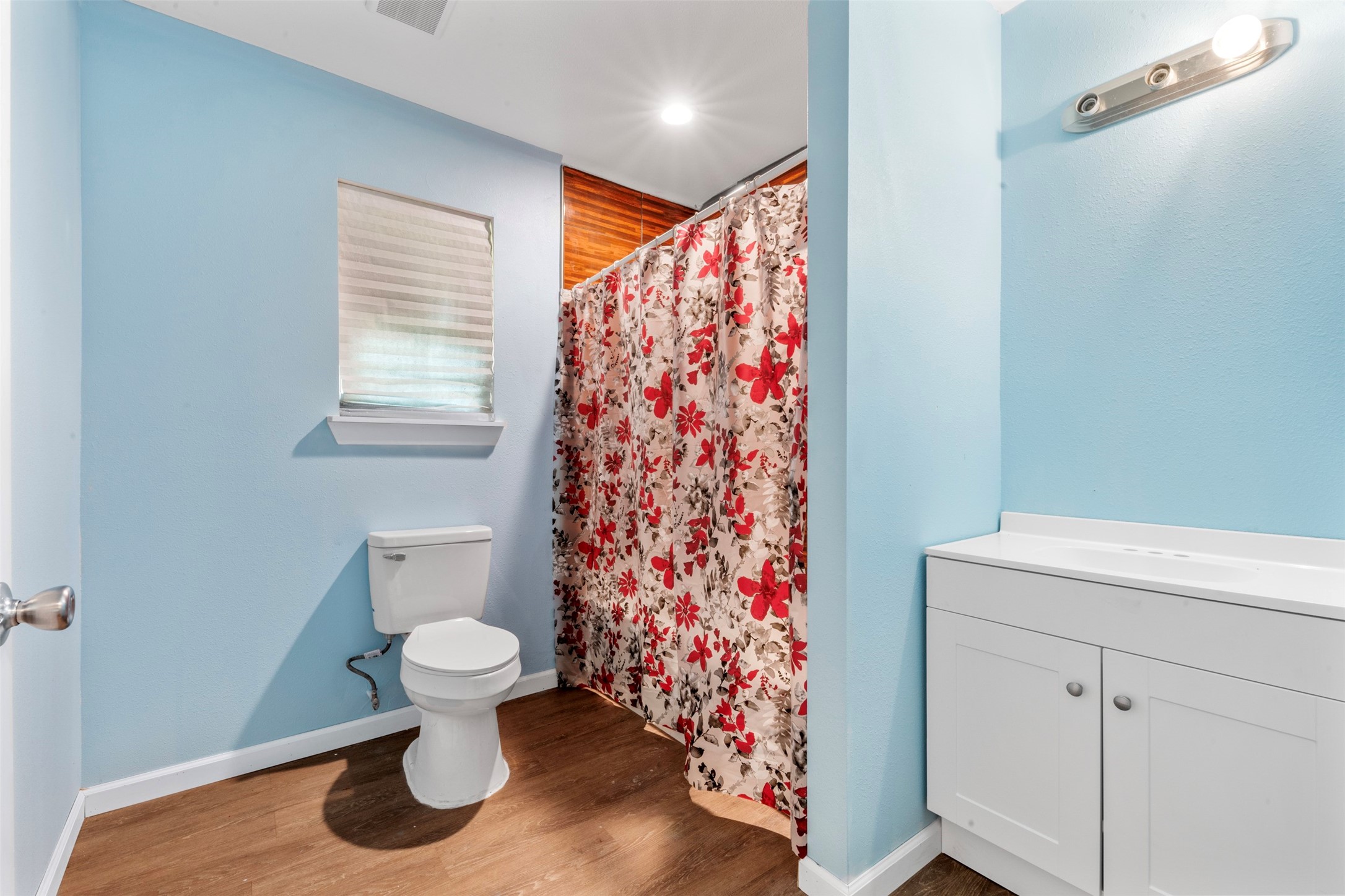 235 Bracewell Cemetery Road Livingston, TX 77351 - Photo 18 of 39 a bathroom with a toilet and a shower curtain