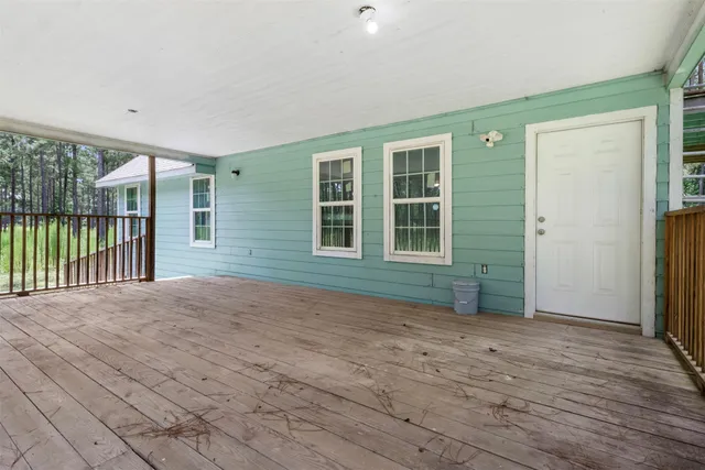 a view of an empty room with balcony