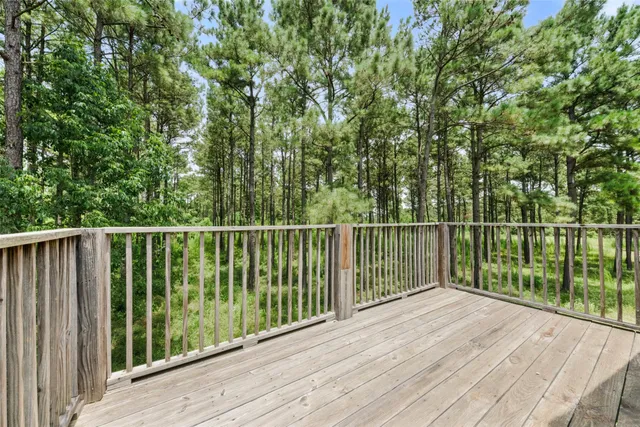 a view of balcony with wooden floor