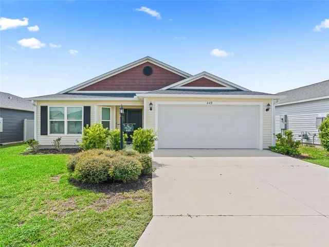 a front view of a house with yard