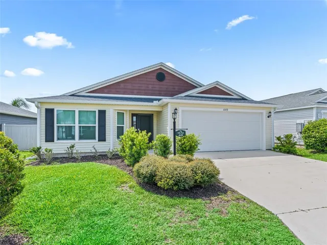 a front view of a house with a yard and porch