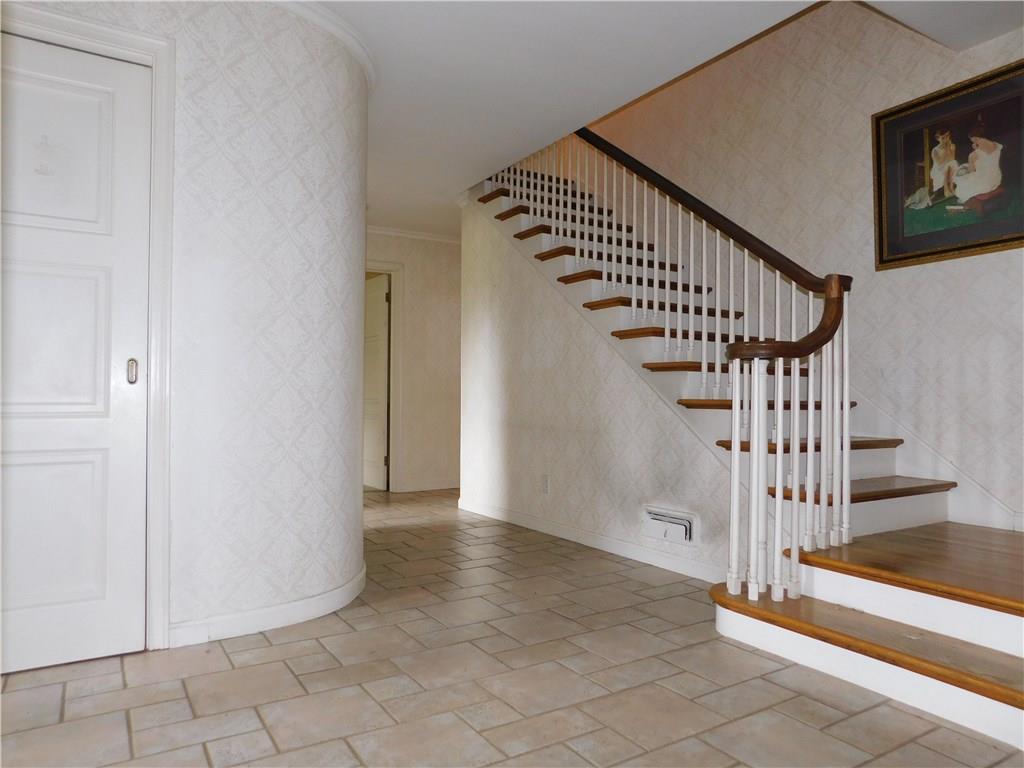 590 Methodist Road Greenville, PA 16125 - Photo 7 of 25 ROUNDED WALL IN FOYER ADDS CHARACTER AND CHARM/OPEN WINDING STAIR CASE CARRIES DESIGN UP THE STAIRS