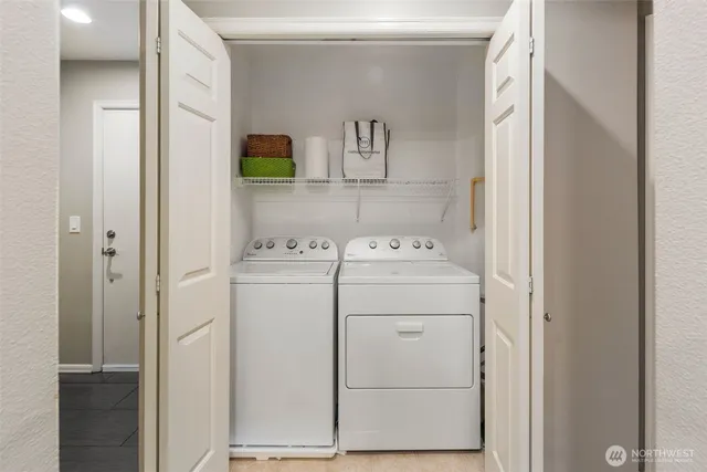 a utility room with dryer and washer