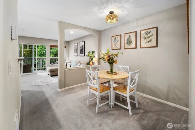 a dining room with furniture and window