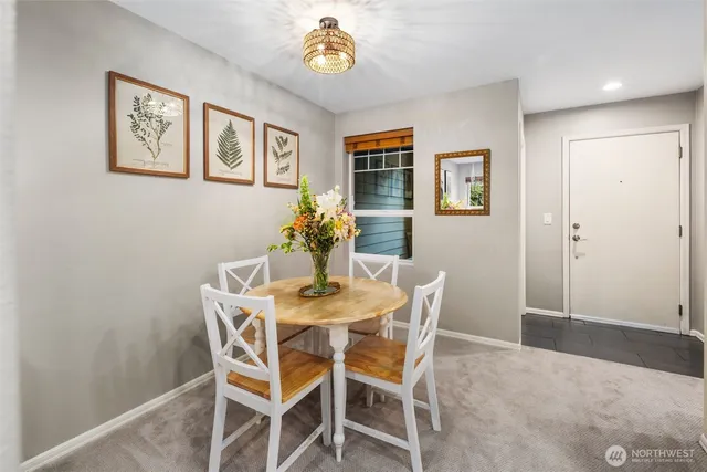 a dining room with furniture and window