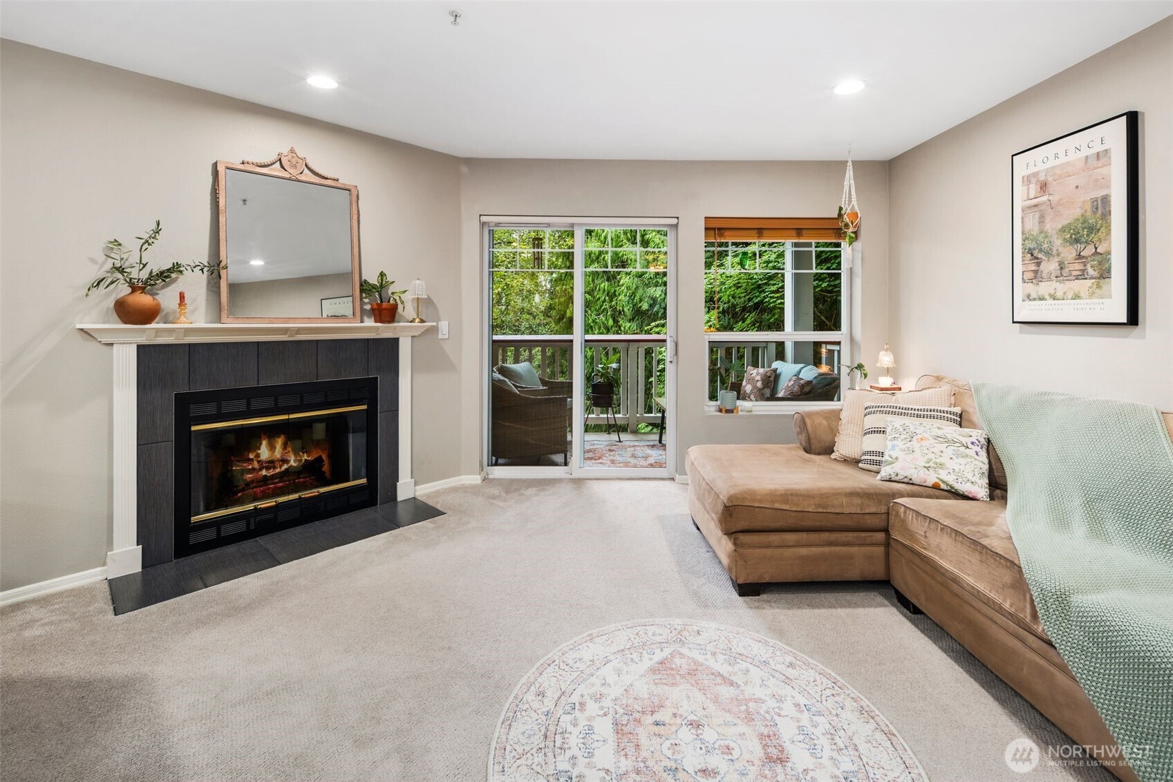 18501 Southeast Newport Way, Unit H236 Issaquah, WA 98027 - Photo 5 of 20 a living room with furniture and a fireplace