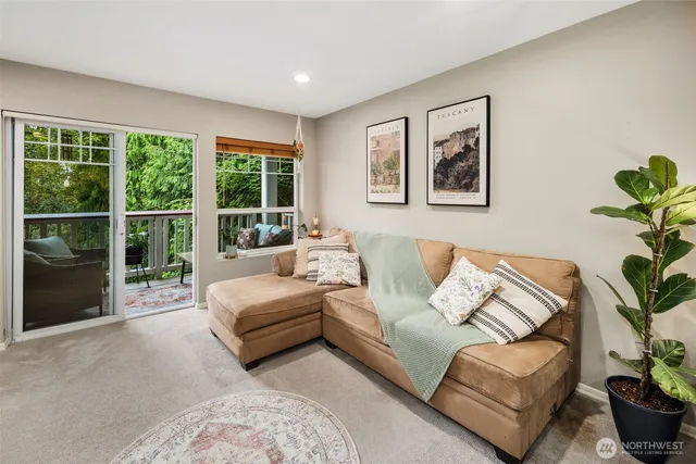 a living room with furniture and a large window