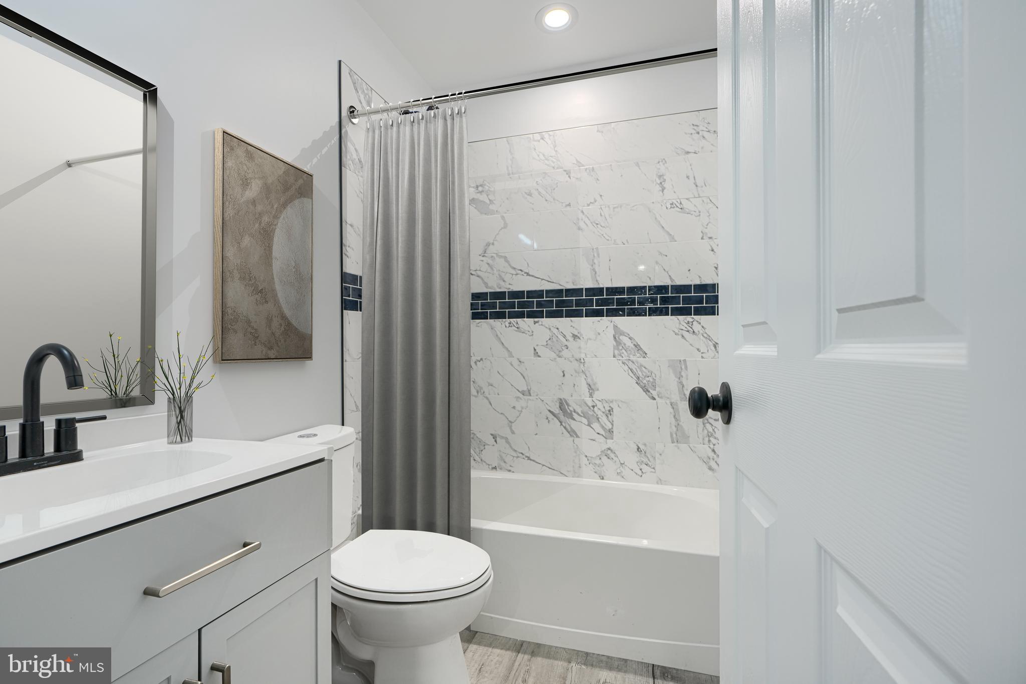 9 Avenal Road Baltimore, MD 21221 - Photo 14 of 30 a bathroom with a sink toilet and shower