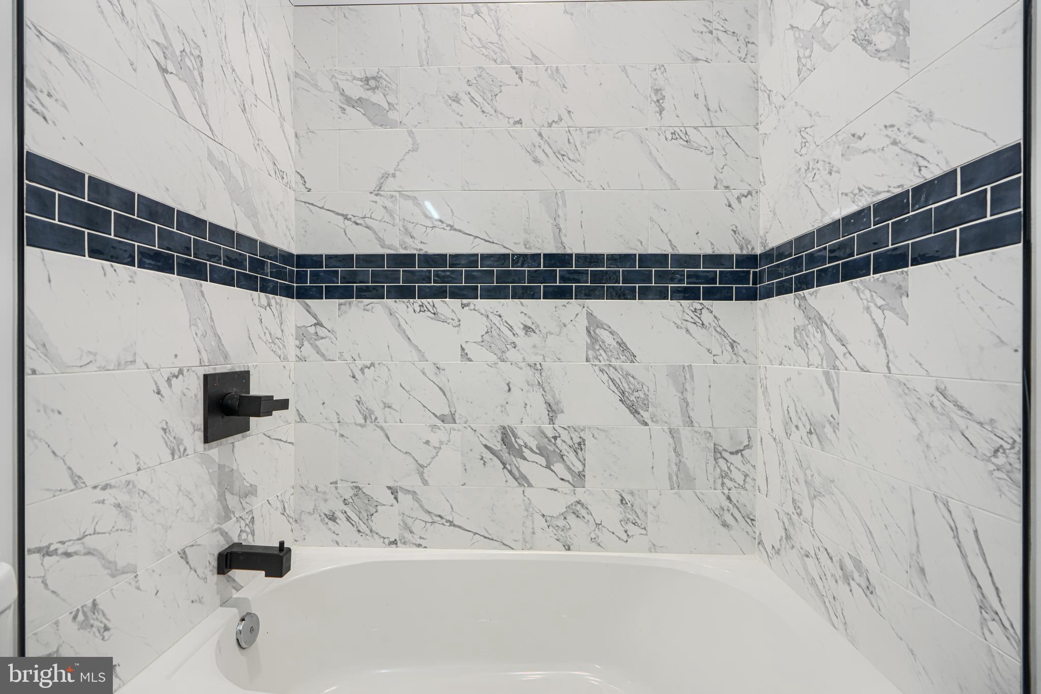 9 Avenal Road Baltimore, MD 21221 - Photo 16 of 30 a bathroom with a bathtub and shower