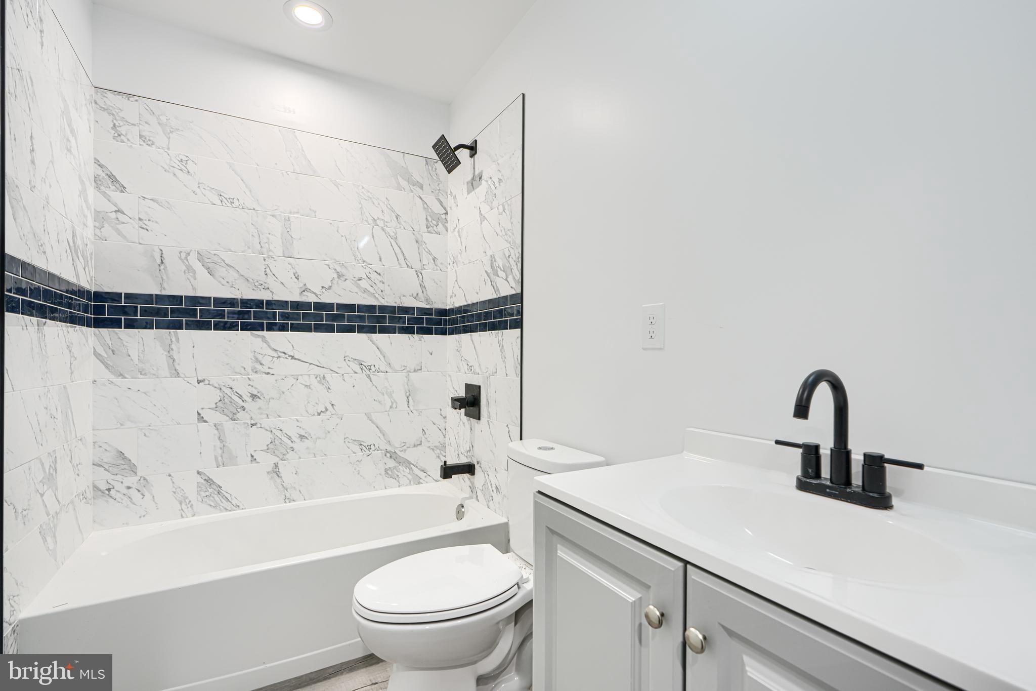 9 Avenal Road Baltimore, MD 21221 - Photo 20 of 30 a bathroom with a sink toilet and shower