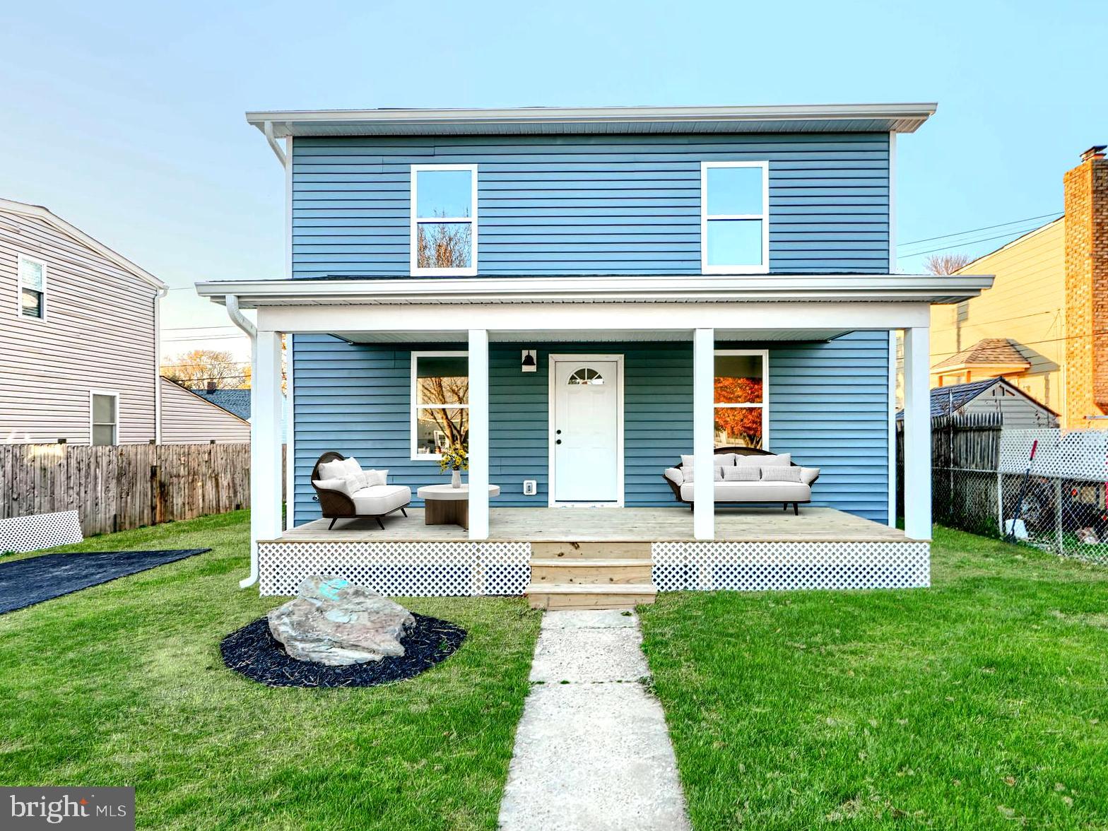 9 Avenal Road Baltimore, MD 21221 - Photo 2 of 30 a front view of a house with a yard and porch
