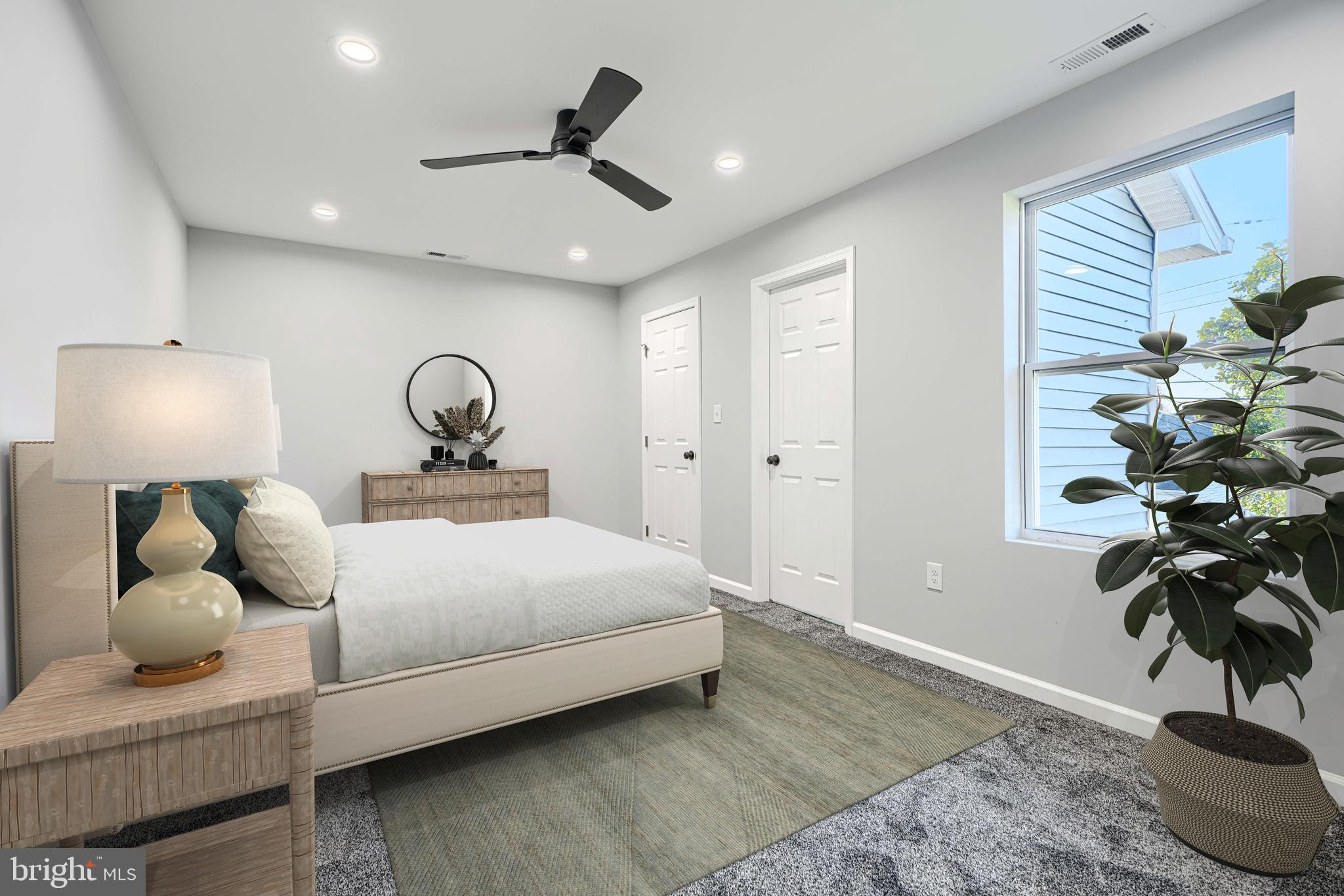 9 Avenal Road Baltimore, MD 21221 - Photo 22 of 30 a bedroom with a bed and a potted plant