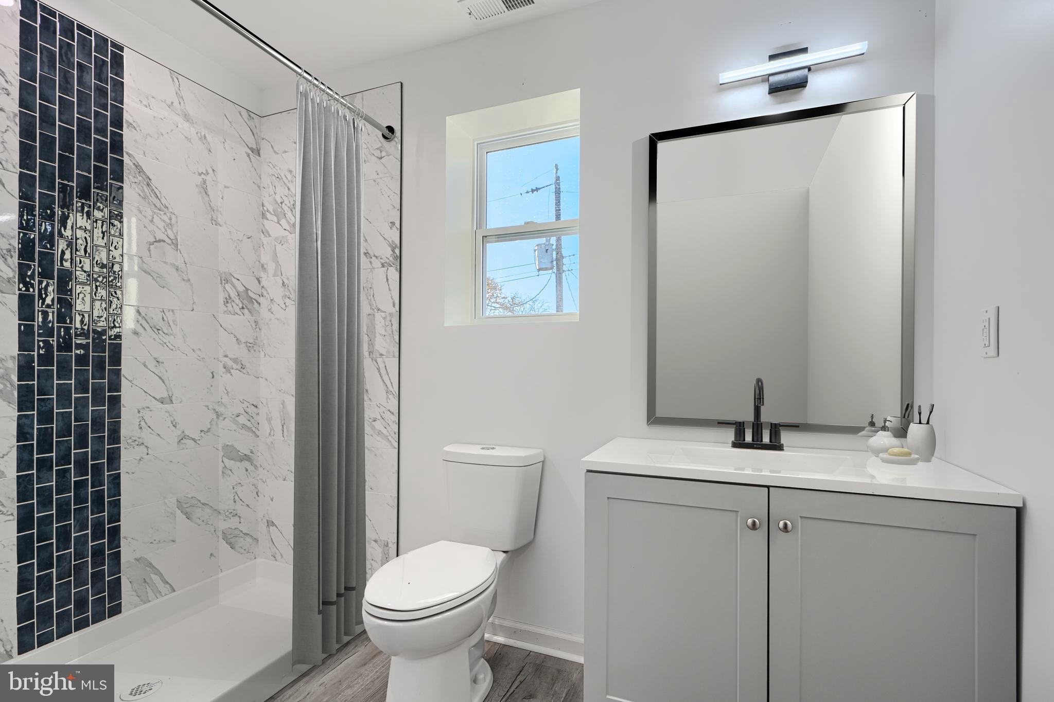 9 Avenal Road Baltimore, MD 21221 - Photo 26 of 30 a bathroom with a sink toilet and shower