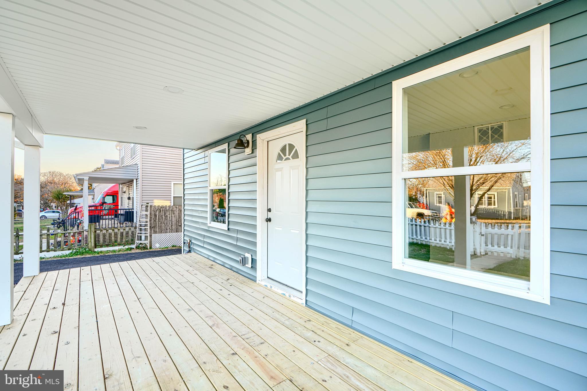 9 Avenal Road Baltimore, MD 21221 - Photo 8 of 30 a view of a porch with wooden floor and outdoor space