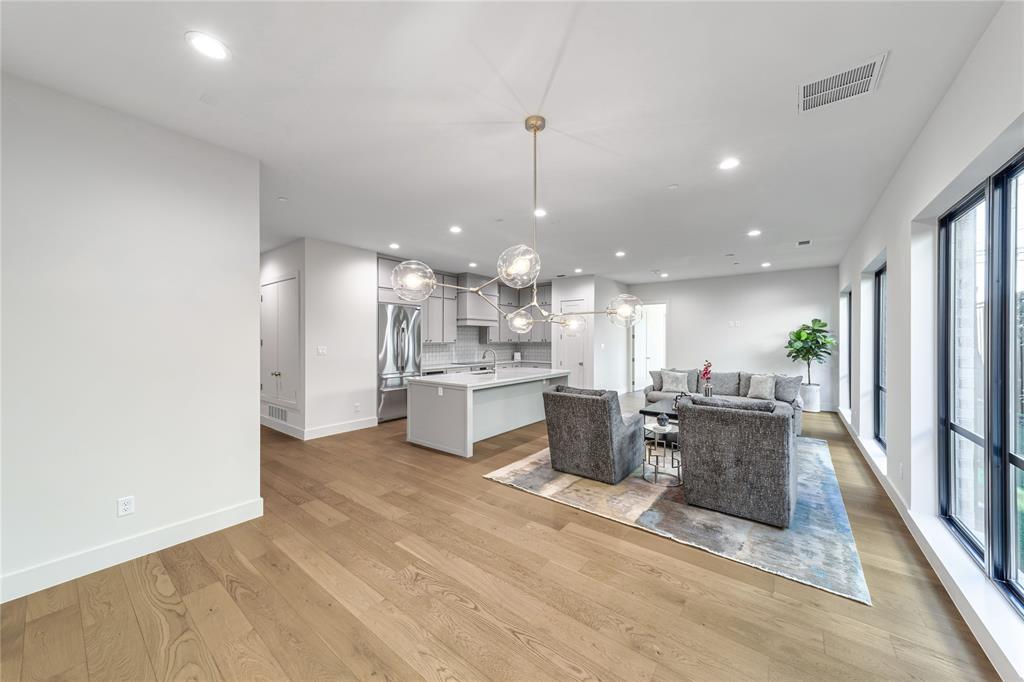 3601 Routh Street, Unit 1B Dallas, TX 75219 - Photo 12 of 22 a view of kitchen with stainless steel appliances kitchen island microwave and stove