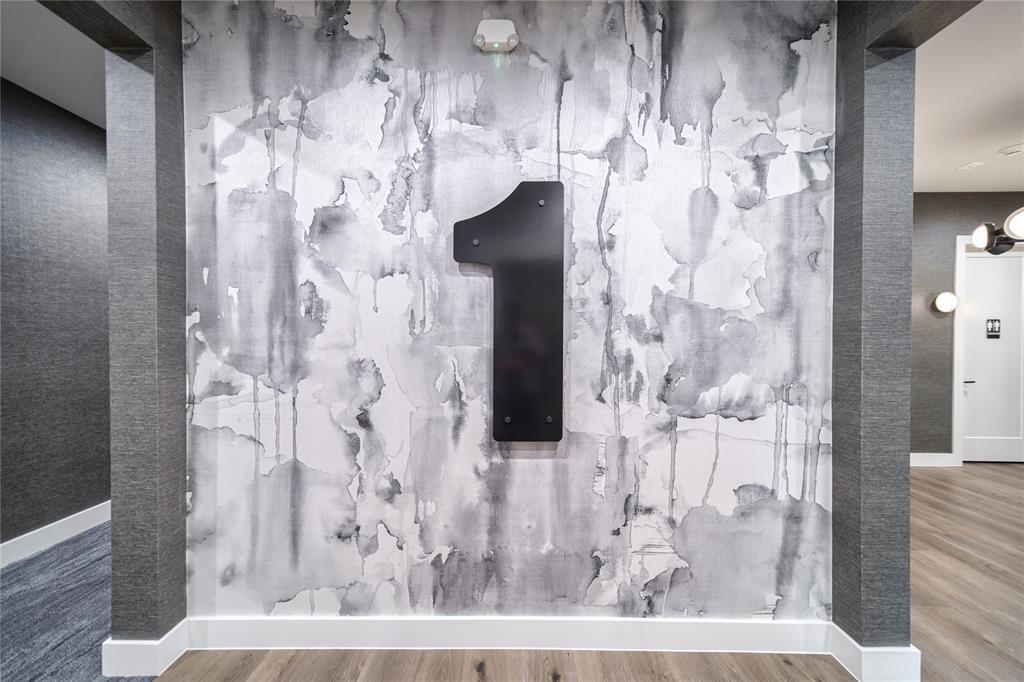 3601 Routh Street, Unit 1B Dallas, TX 75219 - Photo 22 of 22 a view of a bathroom with shower and a mirror