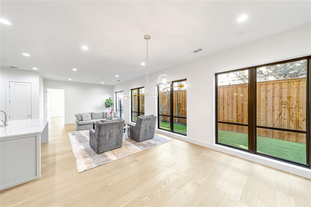 3601 Routh Street, Unit 1B Dallas, TX 75219 - Photo 3 of 22 a view of a living room and kitchen area