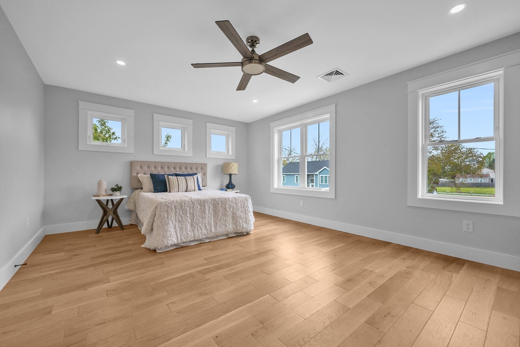 12 Hayes Street, Unit 1 Acushnet, MA 02743 - Photo 18 of 26 a bedroom with a large bed and a large window