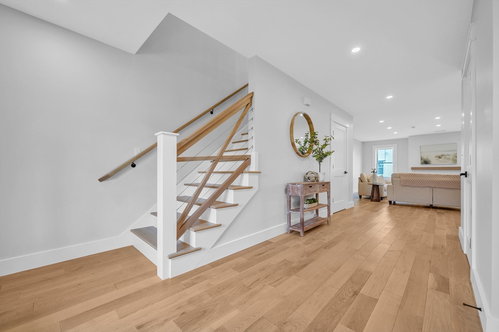 12 Hayes Street, Unit 1 Acushnet, MA 02743 - Photo 7 of 26 a living room with furniture and a wooden floor