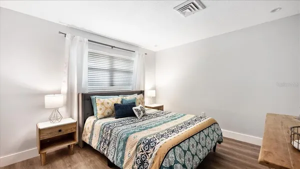 a bedroom with a bed and window