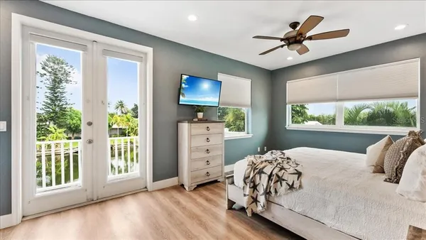 a bedroom with furniture and a window