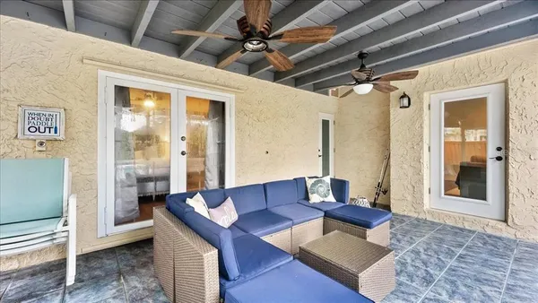 a view of a lake with couches chairs