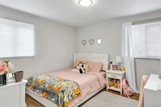 a bathroom with a sink a toilet and shower curtain