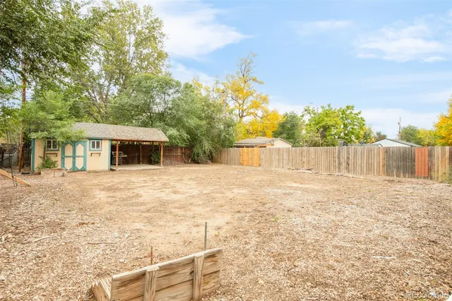 a backyard of a house with lots of green space