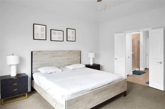 a bedroom with a bed and a night lamp