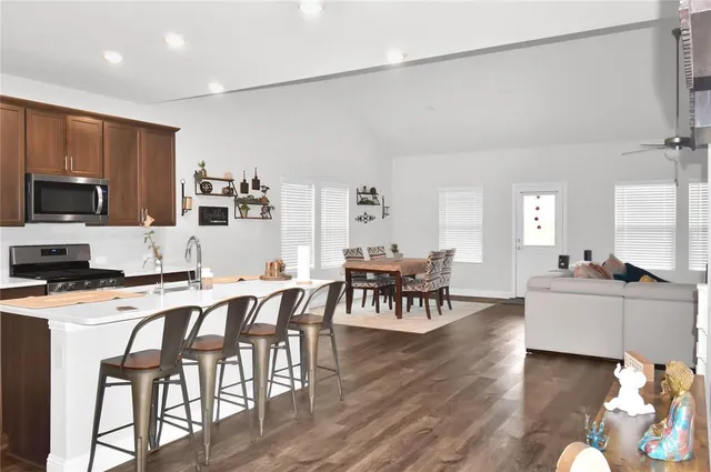 a view of a dining room with furniture and wooden floor