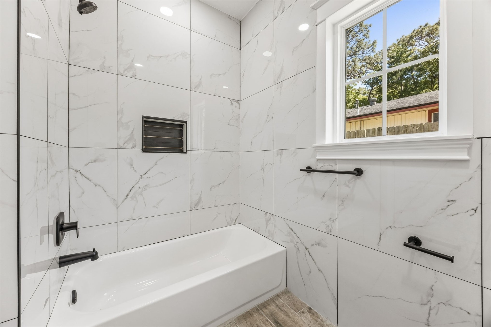 95121 North Ellis Landing Road Fernandina Beach, FL 32034 - Photo 27 of 37 a bathroom with a bathtub and a shower